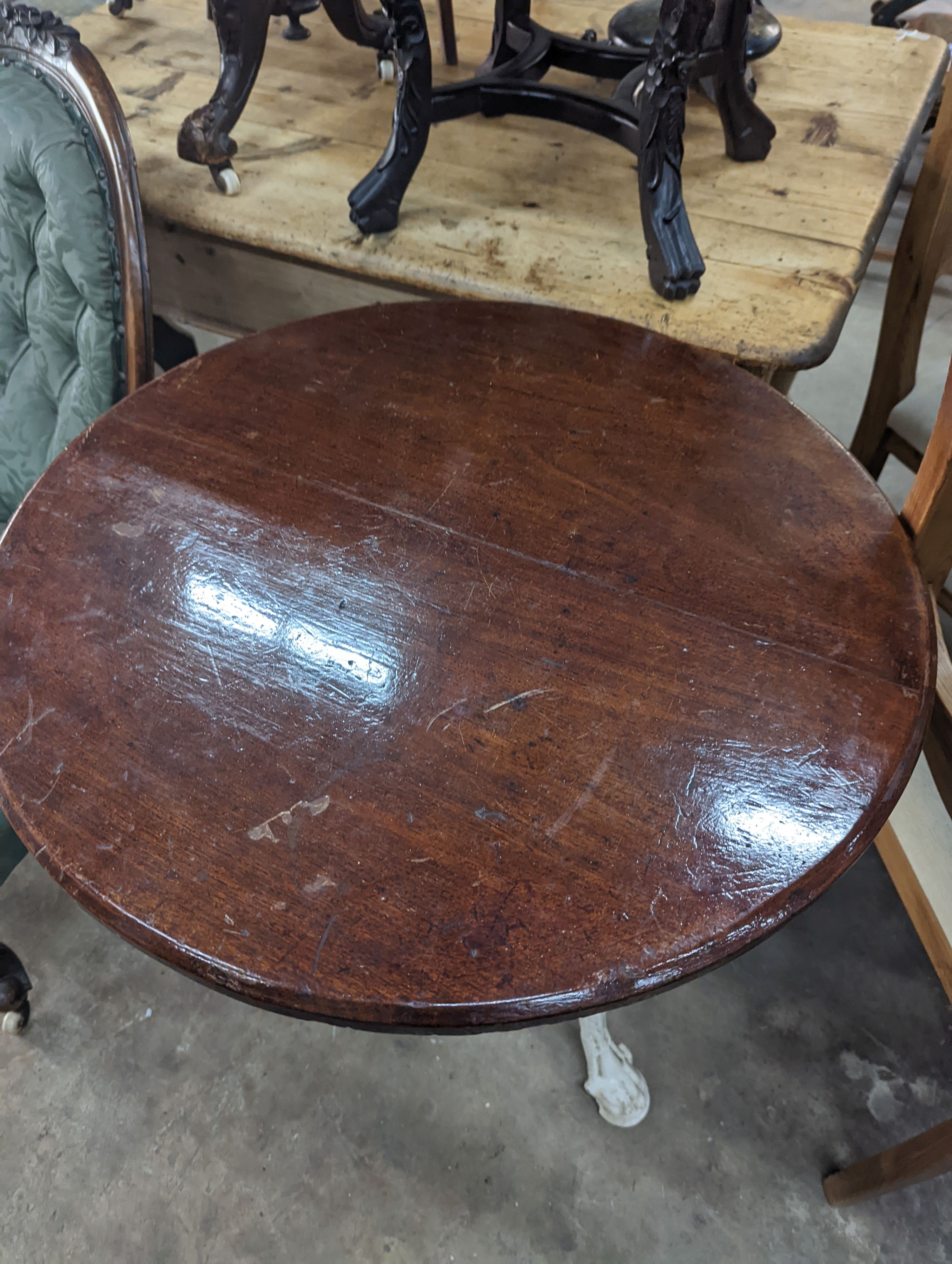 A Victorian white painted cast iron Britannia pub table with circular mahogany top, diameter 66cm, height 74cm